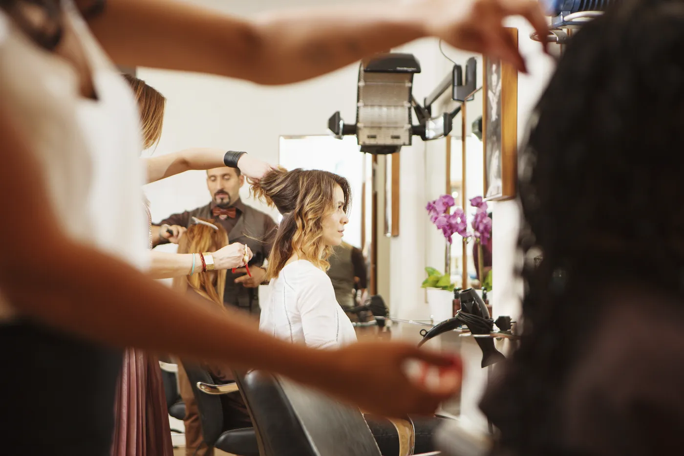 A stylist working with a client